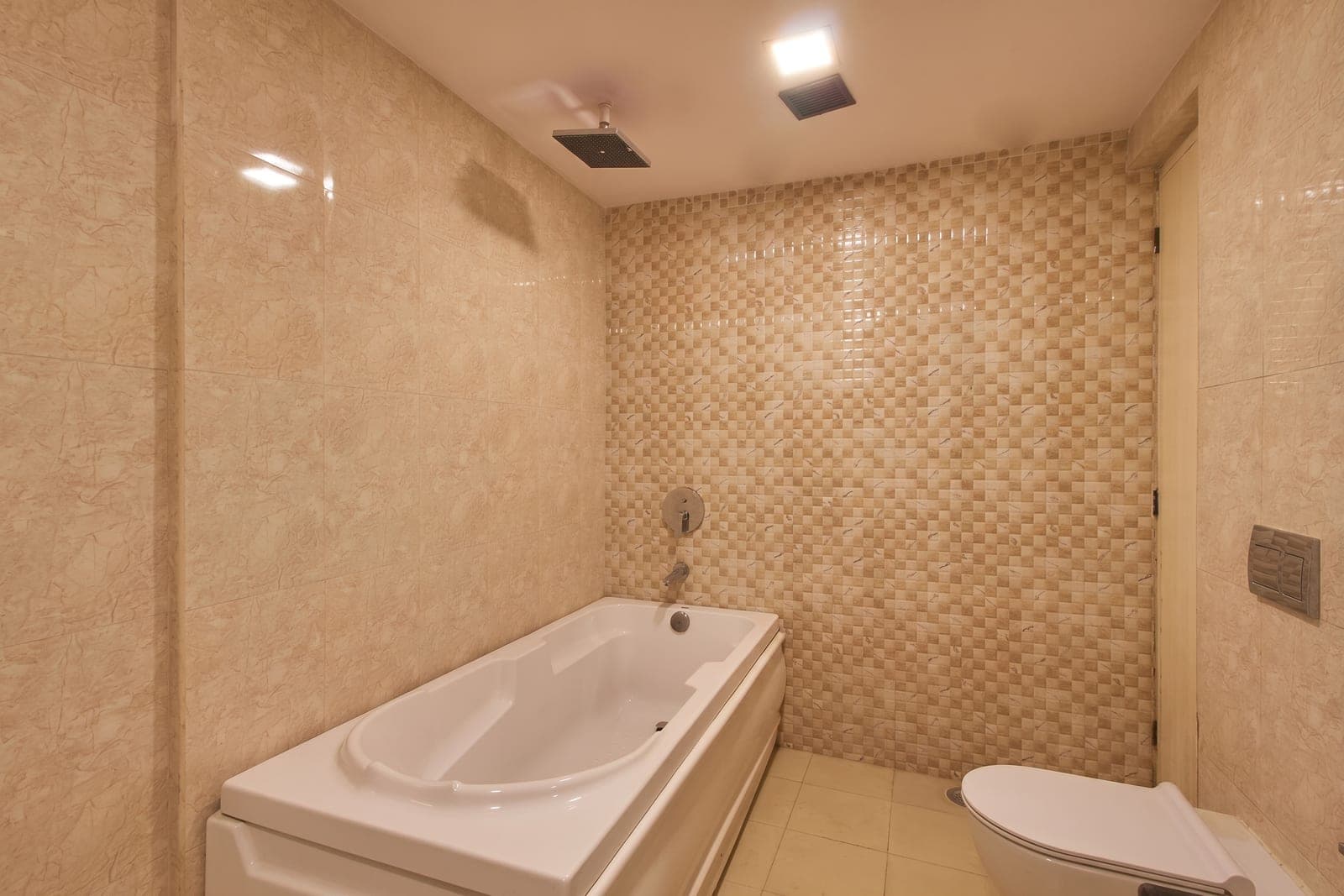 Bathroom with a bathtub and rain shower